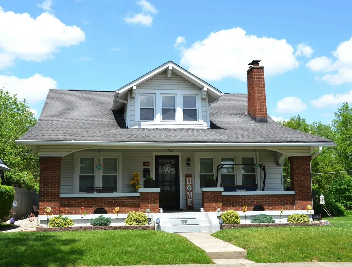 Classic craftsman home with brick porch