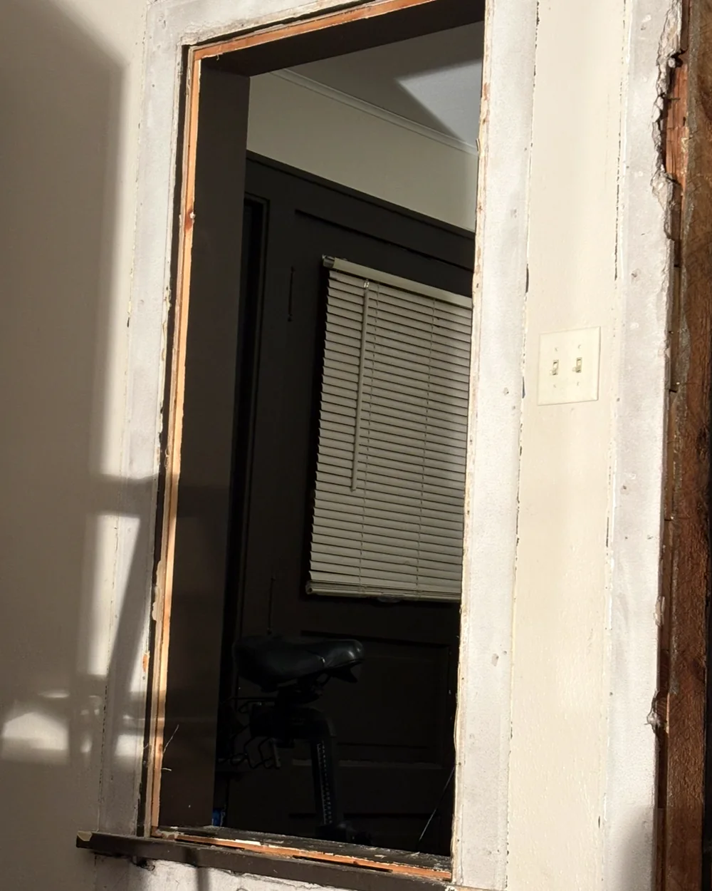 Interior pass-through after the existing trim was removed during demolition and preparation